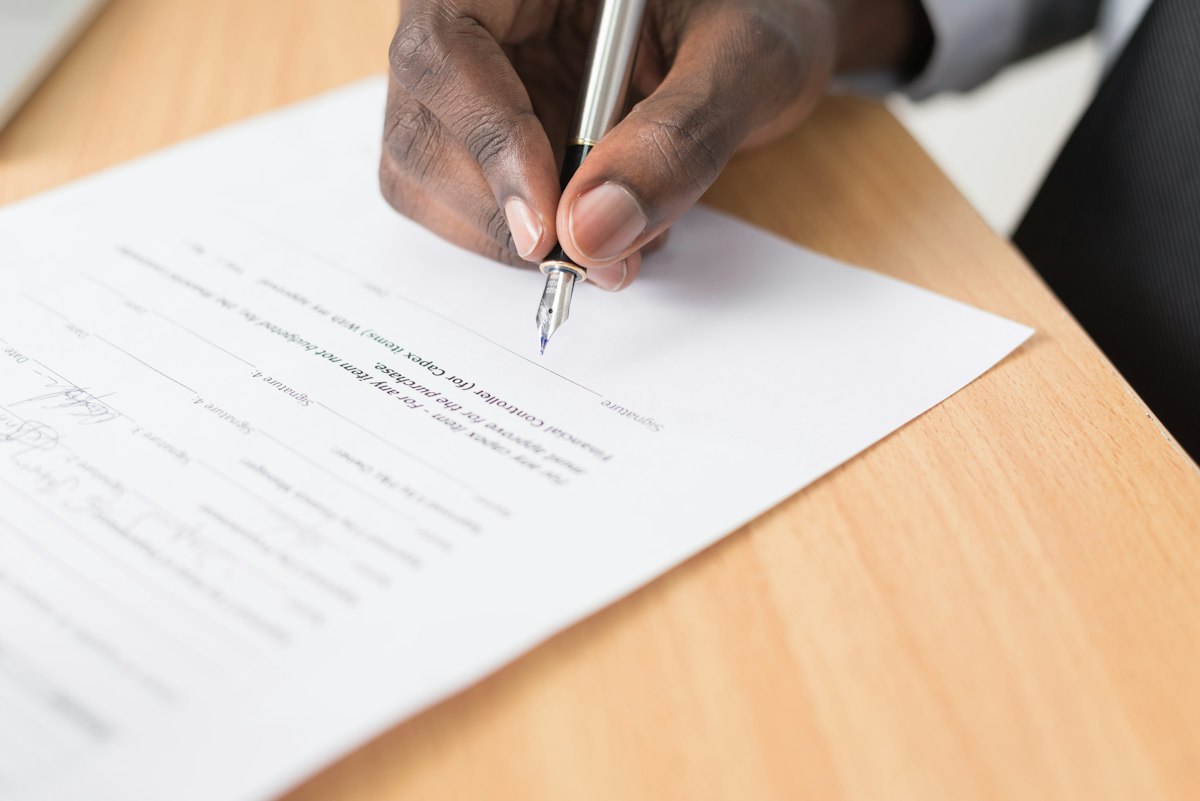 Client signing a loan agreement